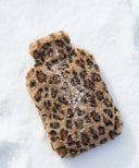 Bouillotte leopard waro posé sur la neige