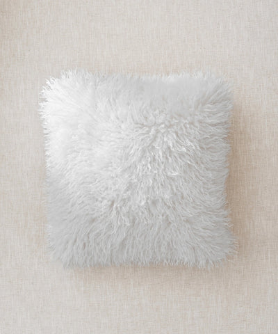 coussin blanc fourrure