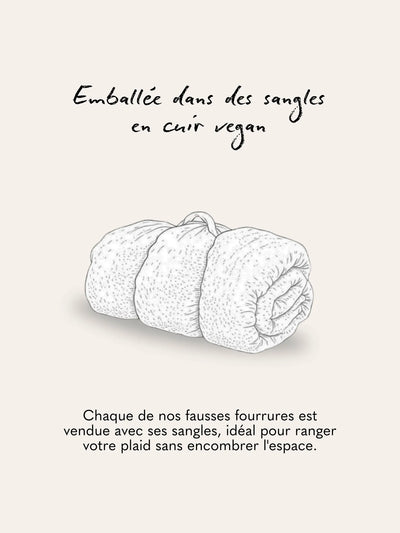 Plaid fausse fourrure Léopard des Neiges WARO emballé avec sangles en cuir vegan.